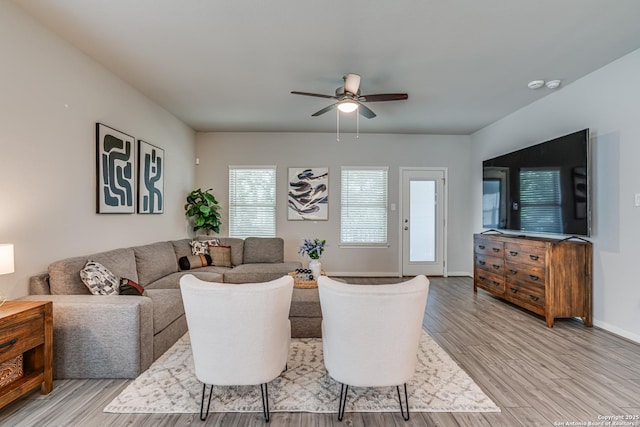 10206 Daylily, Boerne, TX 78006 - living area featuring ceiling fan, light wood-style floors, and baseboards