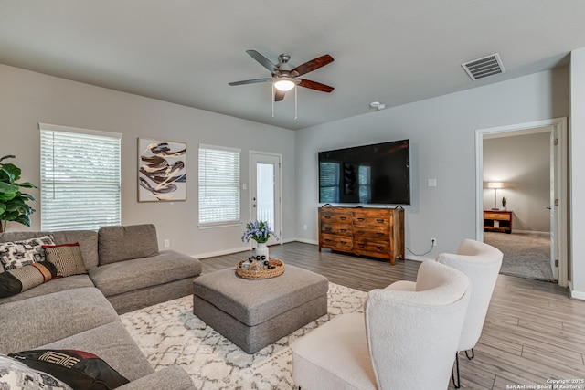10206 Daylily, Boerne, TX 78006 - living room with a ceiling fan, light wood-type flooring, plenty of natural light, and baseboards