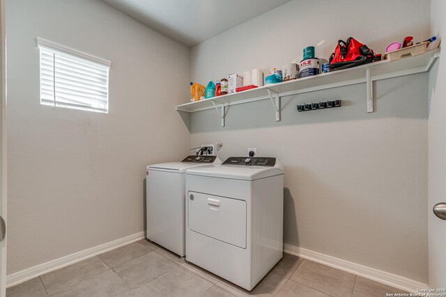 10206 Daylily, Boerne, TX 78006 - washroom with separate washer and dryer, light tile patterned floors, and baseboards