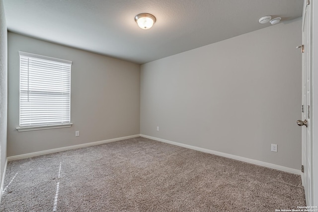 10206 Daylily, Boerne, TX 78006 - carpeted spare room featuring baseboards and a smoke detector