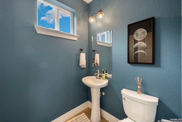 1618 W Lawndale Unit, San Antonio, TX 78209 - bathroom with toilet, wood finished floors, and a sink