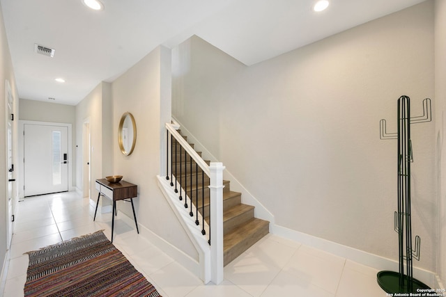 1618 W Lawndale Unit, San Antonio, TX 78209 - tiled foyer entrance with stairway, recessed lighting, and baseboards
