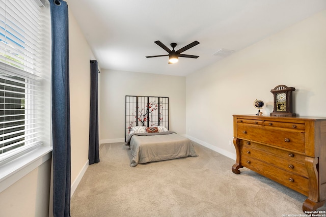 1618 W Lawndale Unit, San Antonio, TX 78209 - bedroom with multiple windows, carpet floors, and baseboards