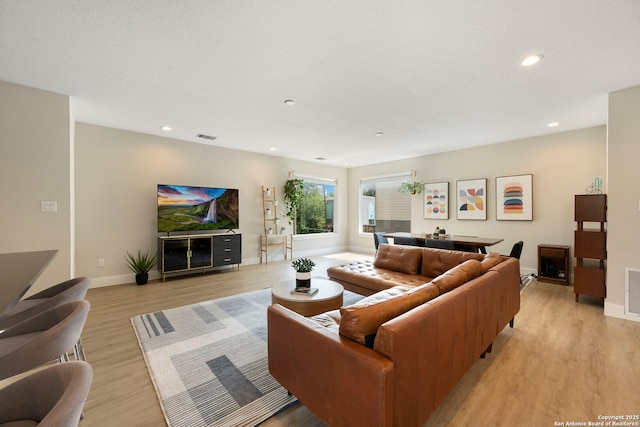1618 W Lawndale Unit, San Antonio, TX 78209 - living room with light wood-style flooring, recessed lighting, and baseboards