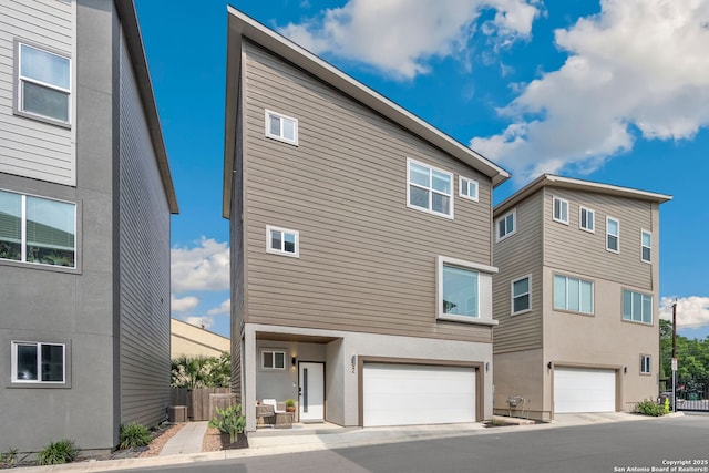 1618 W Lawndale # 2, San Antonio, TX 78209 - back of house with a garage, central AC, and stucco siding