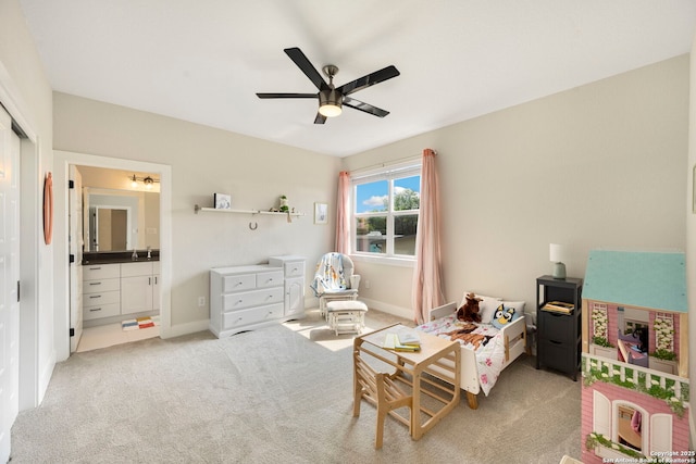 1618 W Lawndale # 2, San Antonio, TX 78209 - bedroom with light colored carpet, ensuite bathroom, a sink, ceiling fan, and baseboards