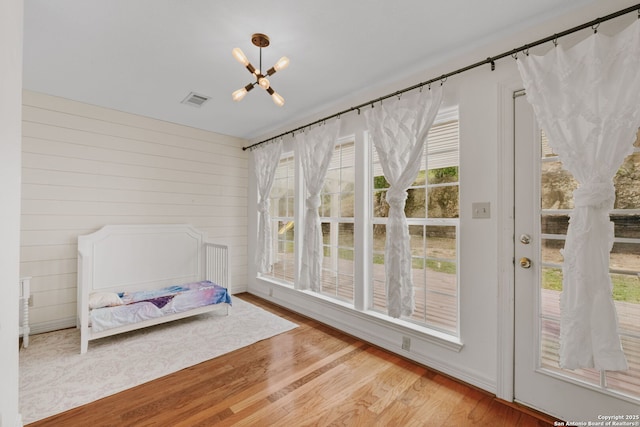 113 Fannin Dr, Kerrville, TX 78028 - unfurnished bedroom with a chandelier and wood finished floors