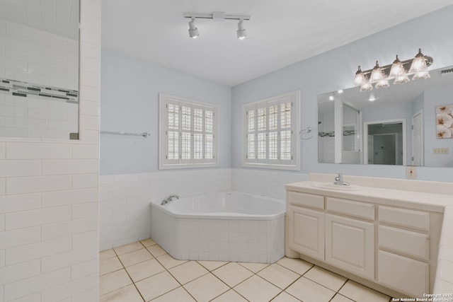 113 Fannin Dr, Kerrville, TX 78028 - bathroom with a garden tub, vanity, and tile patterned flooring