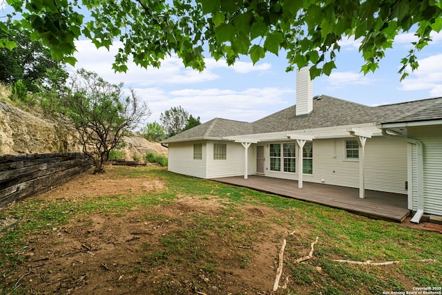 113 Fannin Dr, Kerrville, TX 78028 - rear view of house featuring a chimney, a wooden deck, and roof with shingles