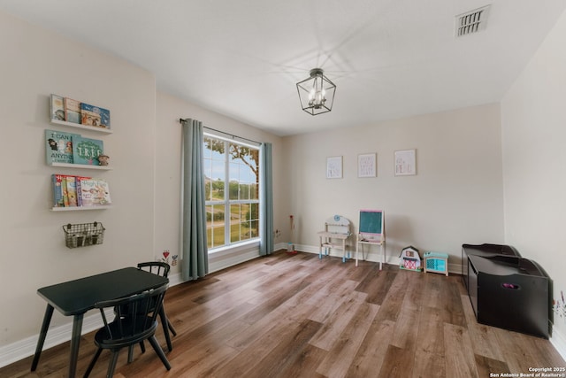 113 Fannin Dr, Kerrville, TX 78028 - miscellaneous room featuring a chandelier, wood finished floors, and baseboards