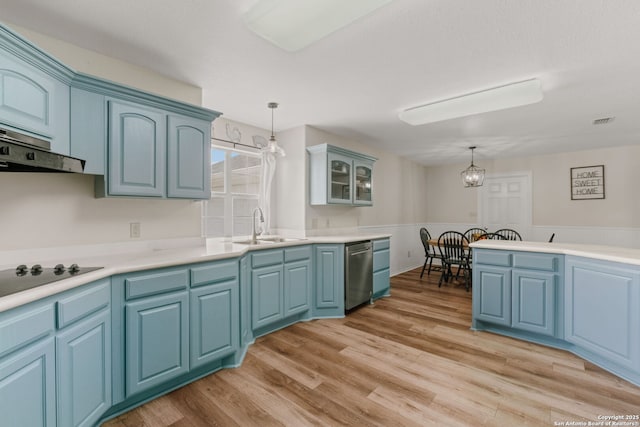113 Fannin Dr, Kerrville, TX 78028 - kitchen featuring dishwasher, black electric stovetop, hanging light fixtures, a sink, and light wood-style floors