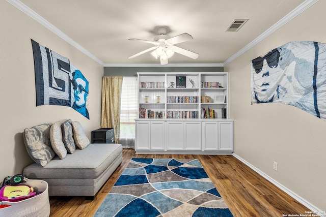 5303 Stormy Sunset, San Antonio, TX 78247 - living area with wood finished floors, a ceiling fan, ornamental molding, and baseboards