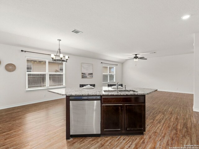 412 Town Frk, Cibolo, TX 78108 - kitchen featuring stainless steel dishwasher, a sink, open floor plan, light wood finished floors, and an island with sink