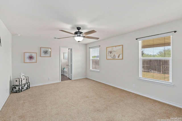 412 Town Frk, Cibolo, TX 78108 - spare room featuring carpet flooring, ceiling fan, and baseboards