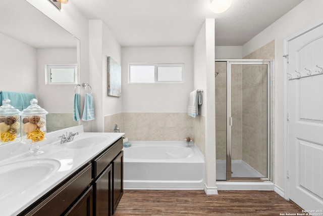 412 Town Frk, Cibolo, TX 78108 - full bathroom featuring a stall shower, a garden tub, double vanity, and wood finished floors