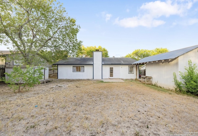 16414 Spruce Cove St, San Antonio, TX 78247 - back of house with a chimney and a patio area