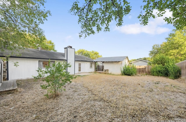 16414 Spruce Cove St, San Antonio, TX 78247 - rear view of property featuring a chimney