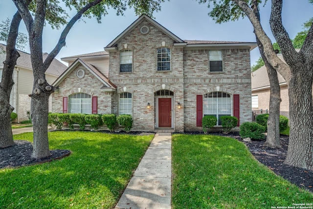 5018 Ashton Audrey, San Antonio, TX 78249 - view of front facade with brick siding and a front lawn