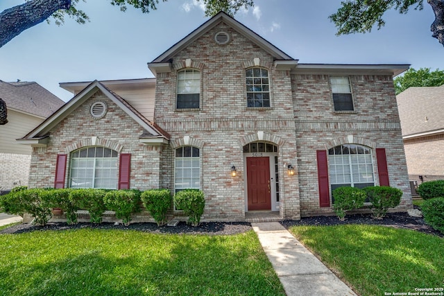 5018 Ashton Audrey, San Antonio, TX 78249 - view of front facade featuring brick siding and a front lawn