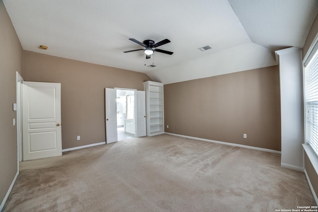 5018 Ashton Audrey, San Antonio, TX 78249 - unfurnished bedroom with light colored carpet, lofted ceiling, baseboards, and ceiling fan