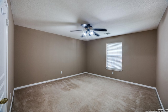 5018 Ashton Audrey, San Antonio, TX 78249 - empty room featuring ceiling fan, carpet floors, baseboards, and a textured ceiling
