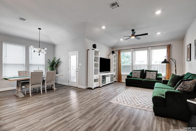 2423 Olive Way, San Antonio, TX 78259 - living room featuring baseboards, wood finished floors, ceiling fan, a chandelier, and lofted ceiling