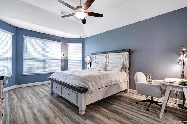 2423 Olive Way, San Antonio, TX 78259 - bedroom featuring wood finished floors, baseboards, a ceiling fan, vaulted ceiling, and a textured wall