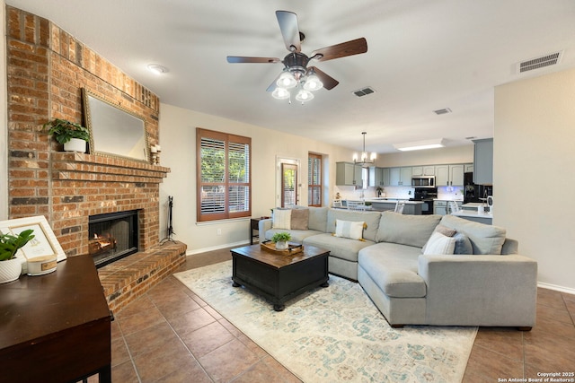 6110 Briscoe Leaf, San Antonio, TX 78253 - tiled living area with a ceiling fan, a chandelier, baseboards, and a brick fireplace
