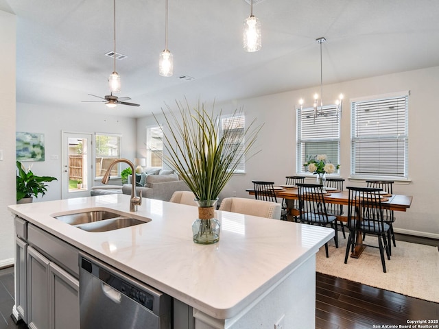 11547 Lightning Way, San Antonio, TX 78245 - kitchen featuring stainless steel dishwasher, a sink, dark wood-style floors, gray cabinetry, and a ceiling fan