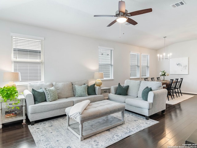 11547 Lightning Way, San Antonio, TX 78245 - living room with a chandelier, dark wood-style floors, lofted ceiling, and ceiling fan