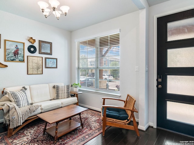 11547 Lightning Way, San Antonio, TX 78245 - living room featuring a chandelier, baseboards, and dark wood-style flooring