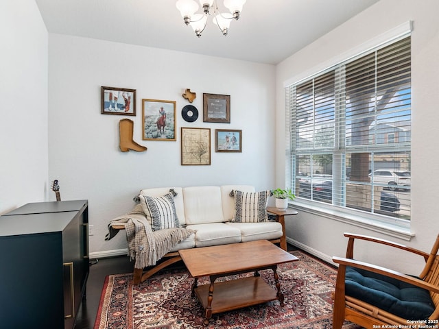 11547 Lightning Way, San Antonio, TX 78245 - living area with a chandelier, baseboards, and wood finished floors