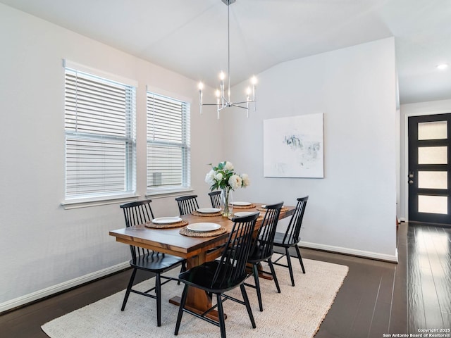 11547 Lightning Way, San Antonio, TX 78245 - dining area featuring baseboards, wood finished floors, a chandelier, and vaulted ceiling