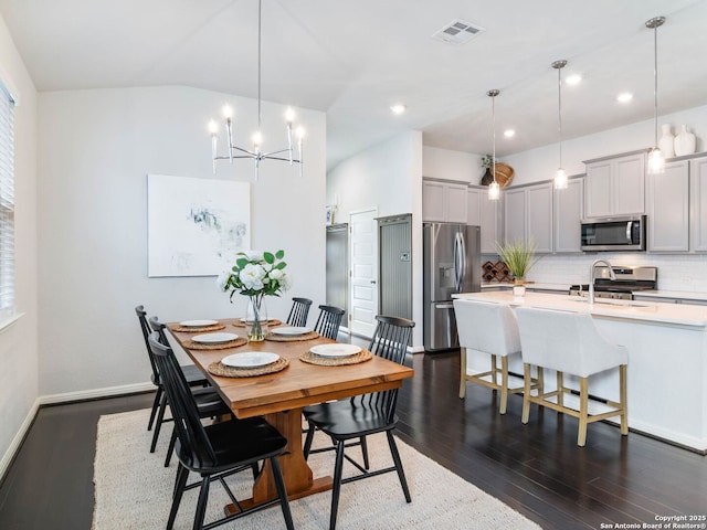 11547 Lightning Way, San Antonio, TX 78245 - dining room featuring dark wood-type flooring, a chandelier, baseboards, and recessed lighting