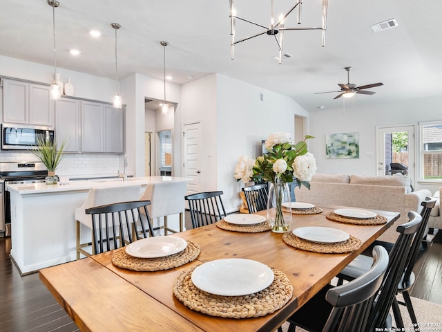 11547 Lightning Way, San Antonio, TX 78245 - dining area featuring dark wood finished floors, ceiling fan, recessed lighting, and lofted ceiling