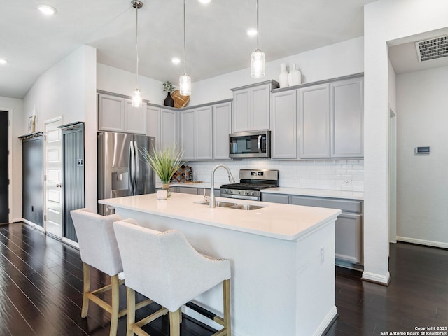 11547 Lightning Way, San Antonio, TX 78245 - kitchen with appliances with stainless steel finishes, gray cabinets, a sink, backsplash, and recessed lighting