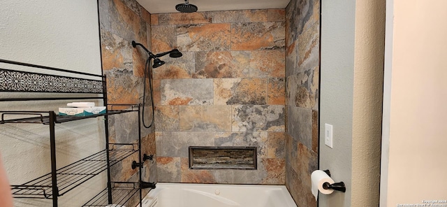8611 Datapoint Unit 59, San Antonio, TX 78229 - bathroom view of a combined bath / shower with rainfall shower and a textured wall