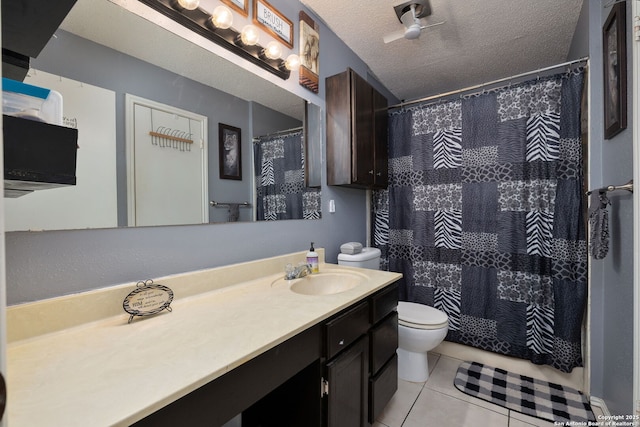 6283 Valley Bay, San Antonio, TX 78250 - bathroom with toilet, tile patterned flooring, vanity, a shower with shower curtain, and a textured ceiling