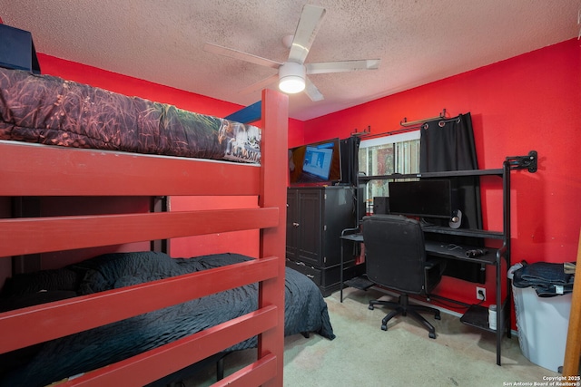 6283 Valley Bay, San Antonio, TX 78250 - carpeted bedroom with a textured ceiling, a desk, and ceiling fan