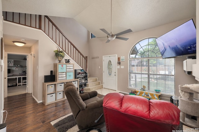 6283 Valley Bay, San Antonio, TX 78250 - living area with ceiling fan, stairway, wood finished floors, lofted ceiling, and baseboards
