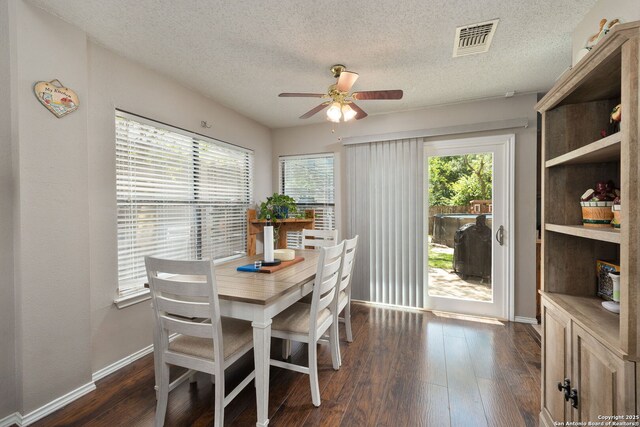 6283 Valley Bay, San Antonio, TX 78250 - dining room featuring a ceiling fan, a textured ceiling, dark wood-type flooring, and baseboards