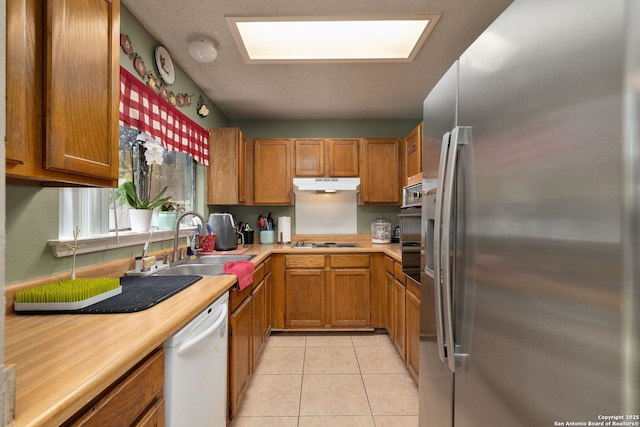 6283 Valley Bay, San Antonio, TX 78250 - kitchen featuring white appliances, under cabinet range hood, a sink, light countertops, and brown cabinets