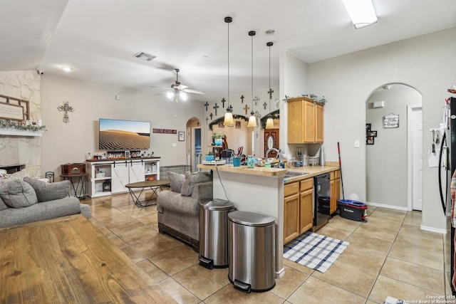1842 Wayward, Pleasanton, TX 78064 - kitchen featuring arched walkways, open floor plan, a sink, and light tile patterned floors