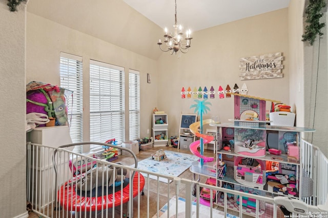 1842 Wayward, Pleasanton, TX 78064 - recreation room featuring vaulted ceiling, a chandelier, baseboards, and wood finished floors