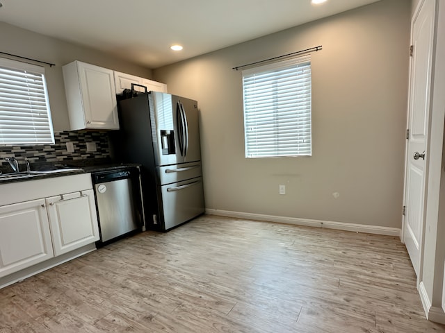 10539 Legacy, San Antonio, TX 78240 - kitchen with stainless steel appliances, dark countertops, recessed lighting, baseboards, and a sink