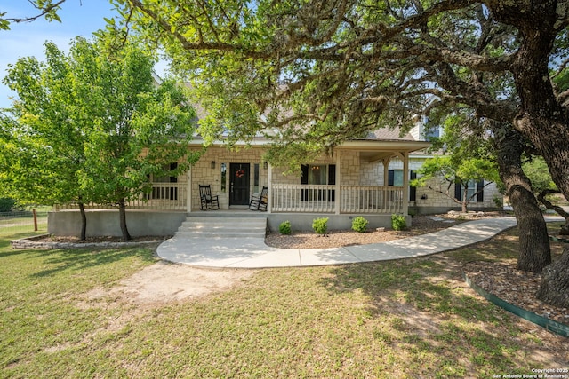 102 Kendall View Dr, Boerne, TX 78006 - view of front of property featuring covered porch, a front yard, and stone siding