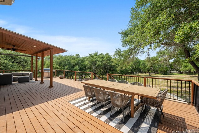 102 Kendall View Dr, Boerne, TX 78006 - wooden deck featuring outdoor dining area, an outdoor hangout area, ceiling fan, and view of scattered trees