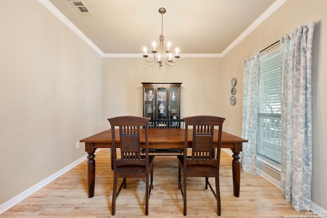 102 Kendall View Dr, Boerne, TX 78006 - dining space with a chandelier, light wood finished floors, crown molding, and baseboards