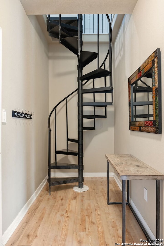 102 Kendall View Dr, Boerne, TX 78006 - stairway with wood finished floors and baseboards