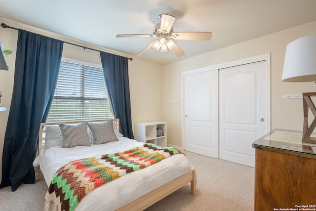 102 Kendall View Dr, Boerne, TX 78006 - bedroom with light colored carpet, a closet, and a ceiling fan